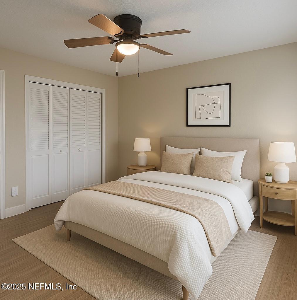 11455 Scott Mill Road Jacksonville, FL 32223 - Photo 3 of 46 a bedroom with a bed and a chandelier