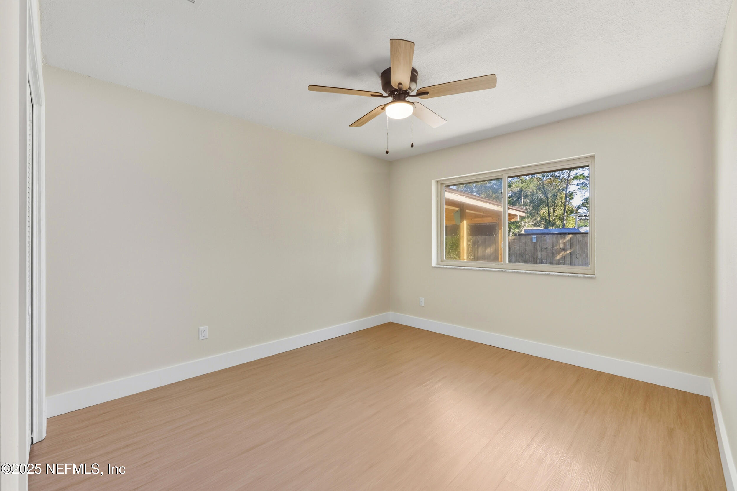 11455 Scott Mill Road Jacksonville, FL 32223 - Photo 33 of 46 a view of an empty room with a window