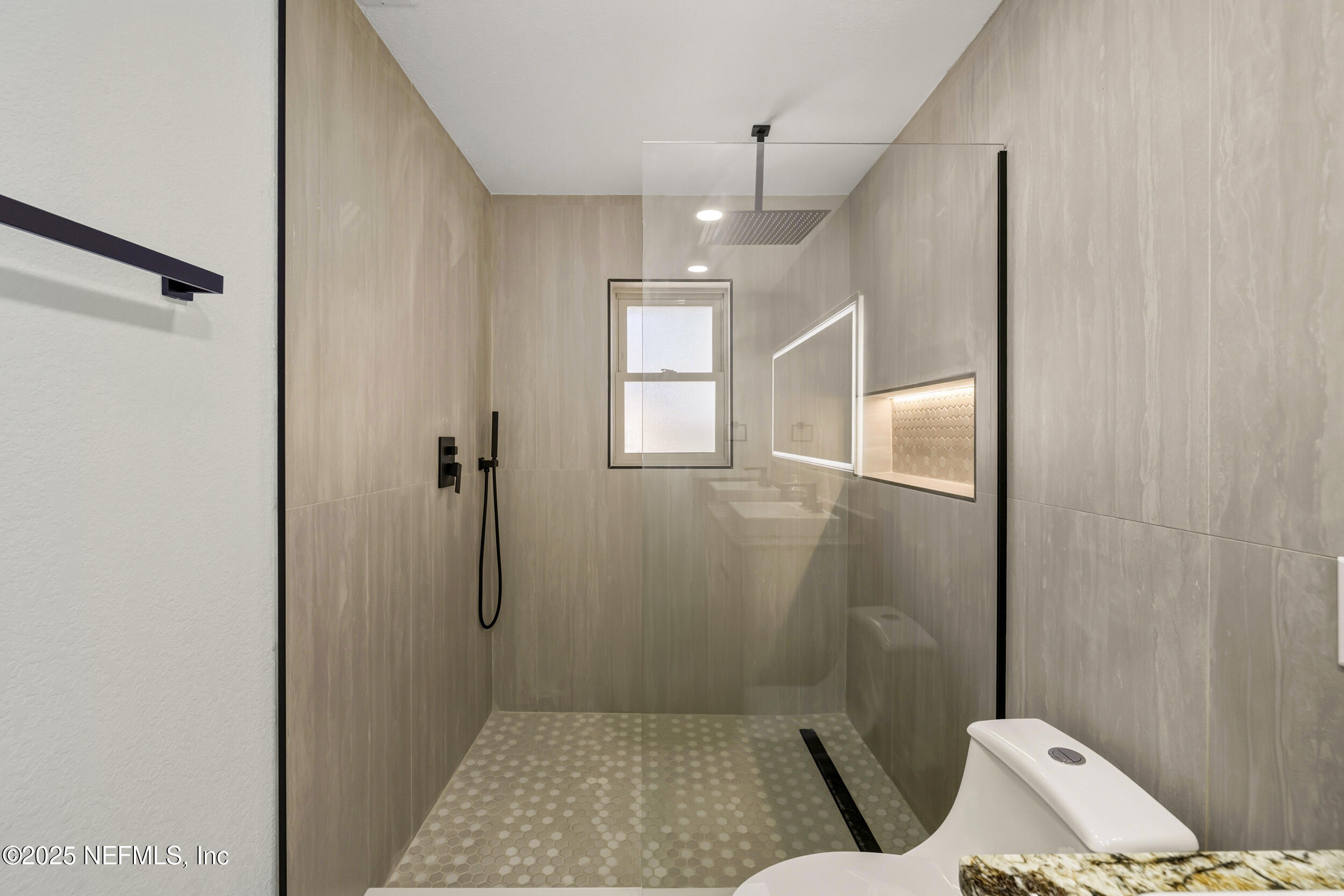 11455 Scott Mill Road Jacksonville, FL 32223 - Photo 40 of 46 a bathroom with a shower and toilet