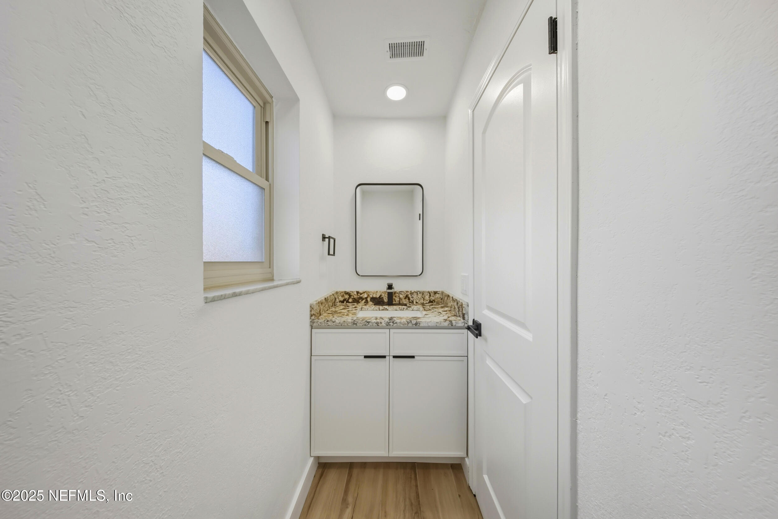 11455 Scott Mill Road Jacksonville, FL 32223 - Photo 43 of 46 a room with a sink and a mirror