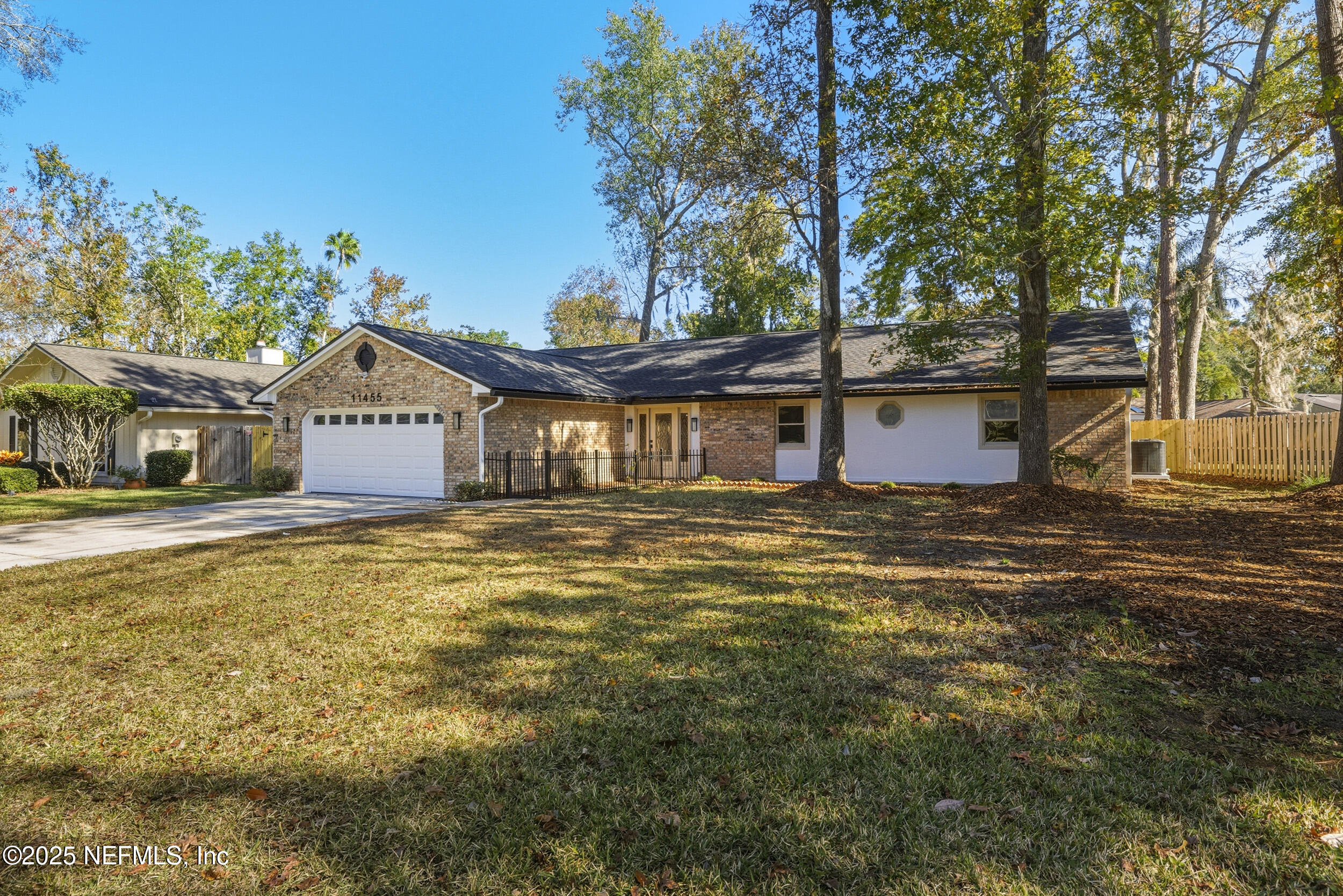 11455 Scott Mill Road Jacksonville, FL 32223 - Photo 6 of 46 a front view of a house with a yard