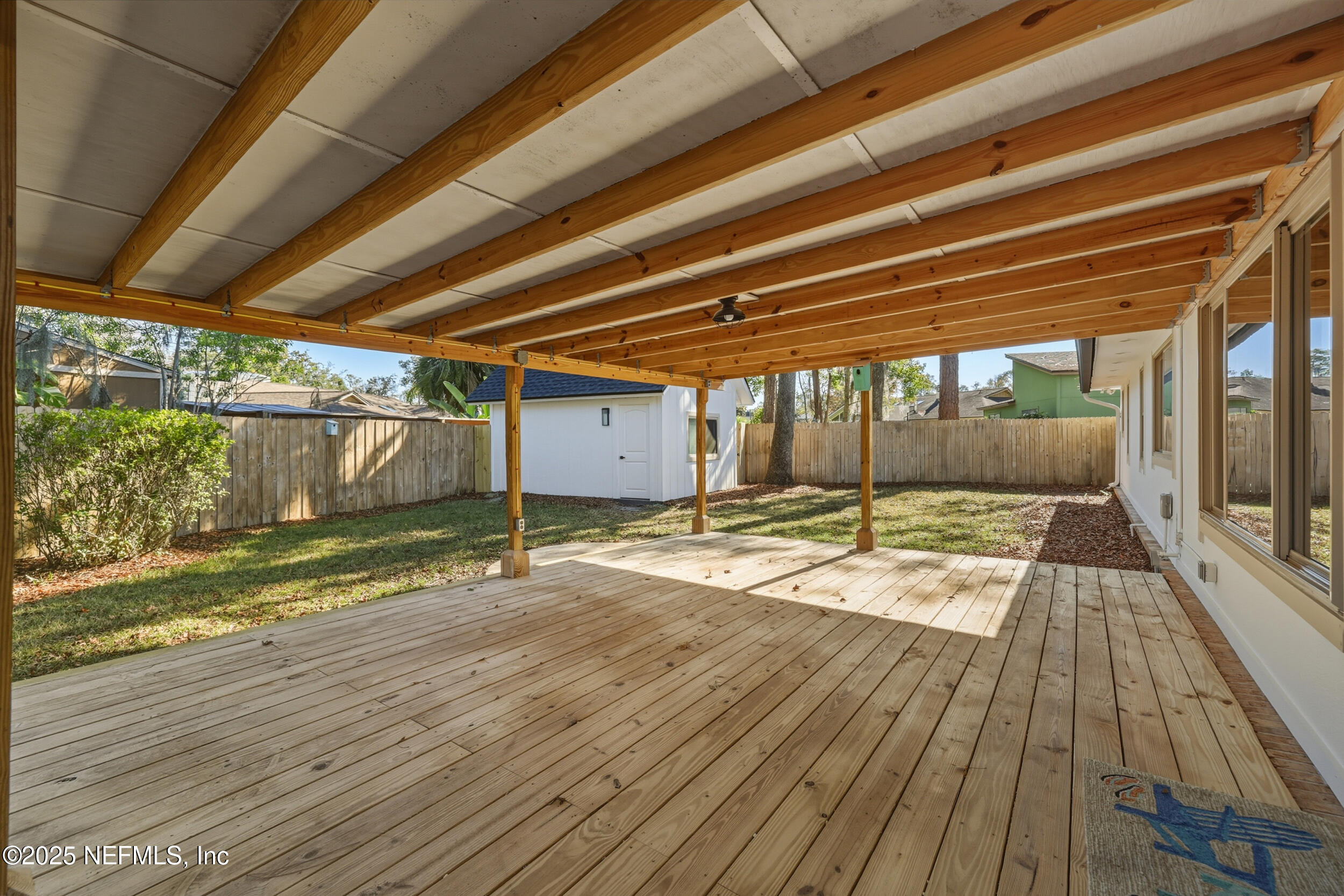 11455 Scott Mill Road Jacksonville, FL 32223 - Photo 9 of 46 a view of empty room with wooden floor