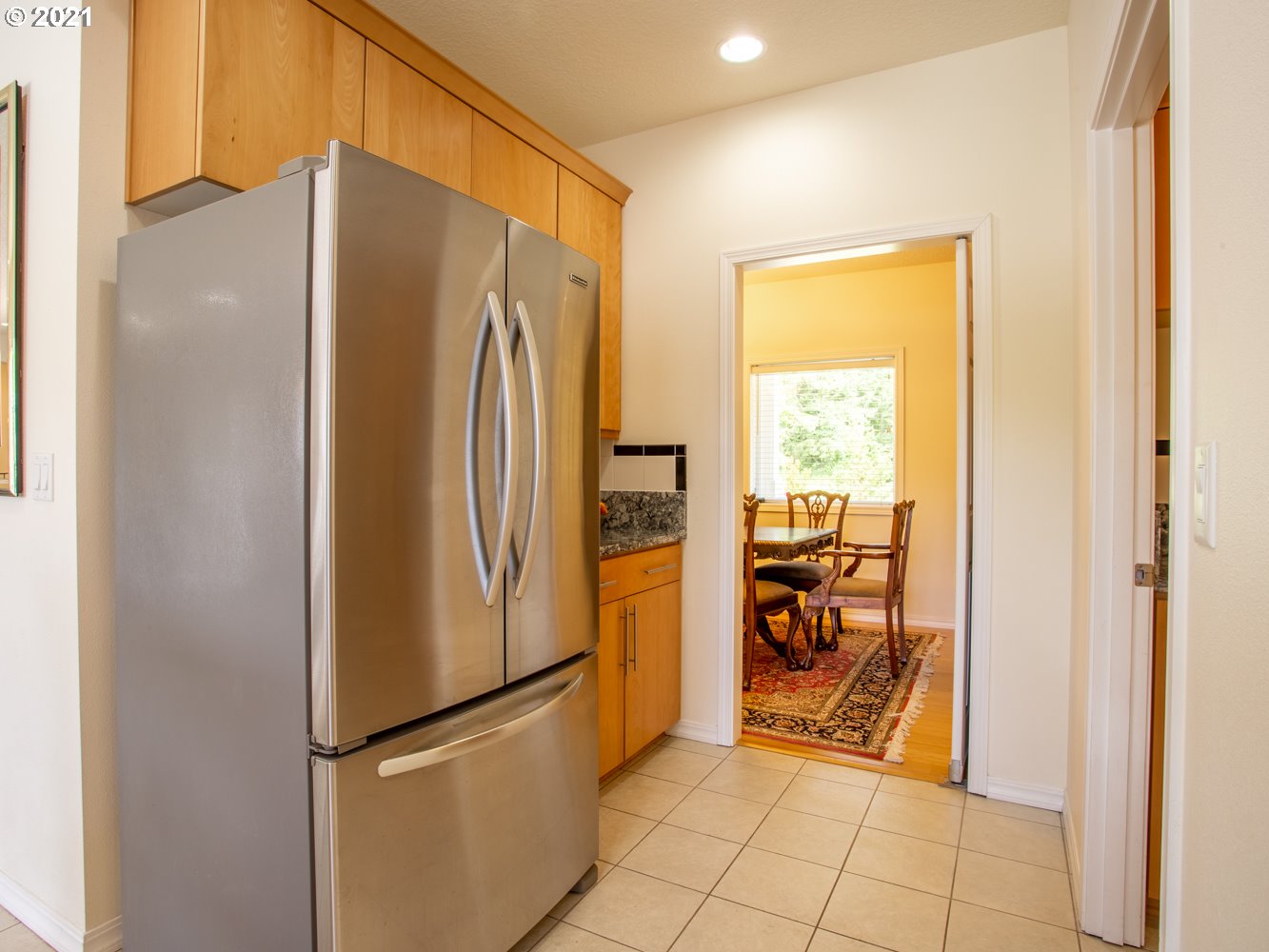 18509 Northeast Risto Road Battle Ground, WA 98604 - Photo 22 of 32 a metallic refrigerator freezer sitting in a kitchen