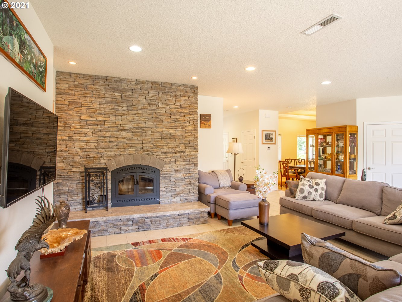 18509 Northeast Risto Road Battle Ground, WA 98604 - Photo 9 of 32 a living room with furniture and a fireplace