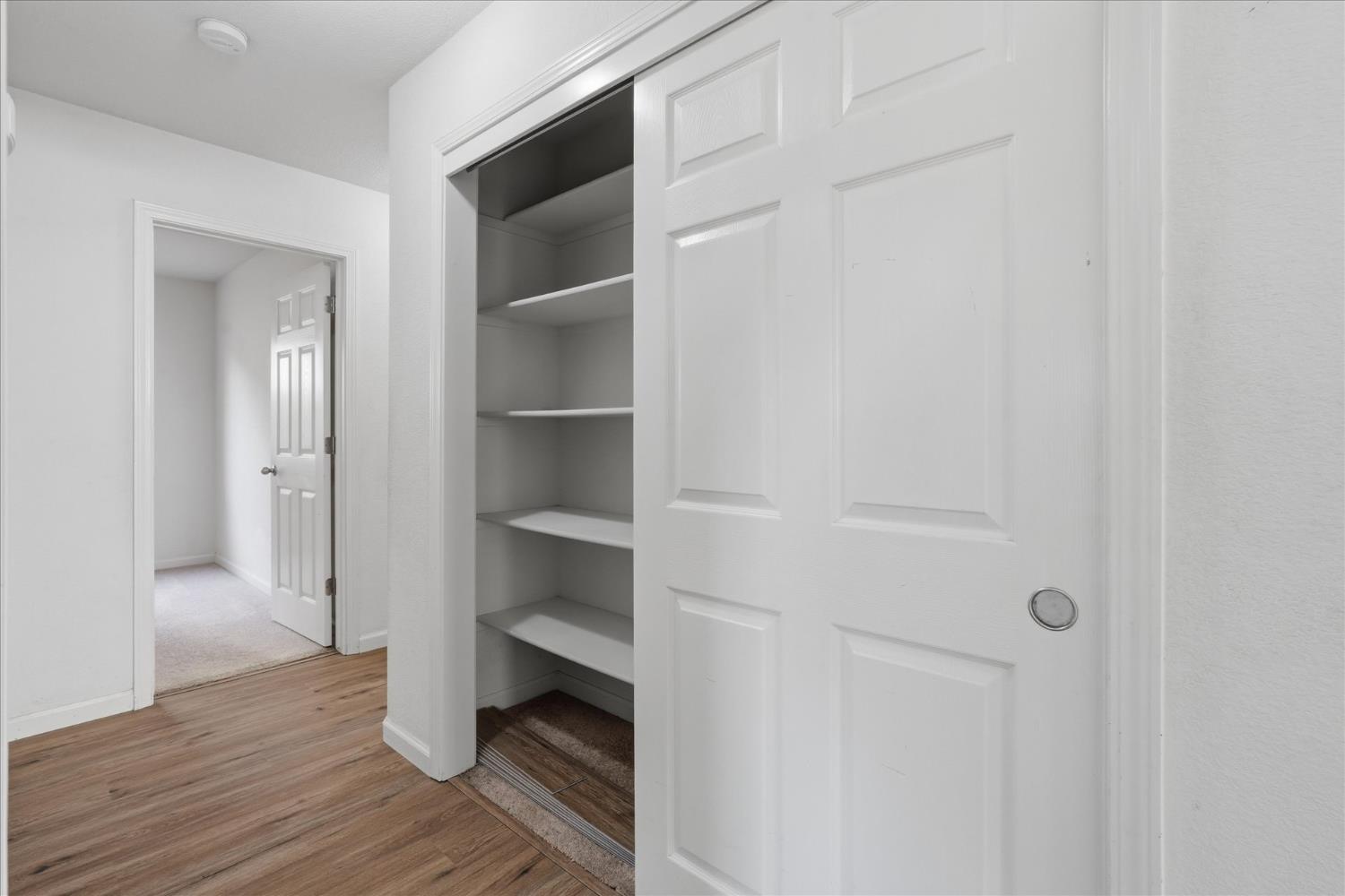 988 Monterey Street Madera, CA 93637 - Photo 15 of 36 a view of walk in closet with empty racks