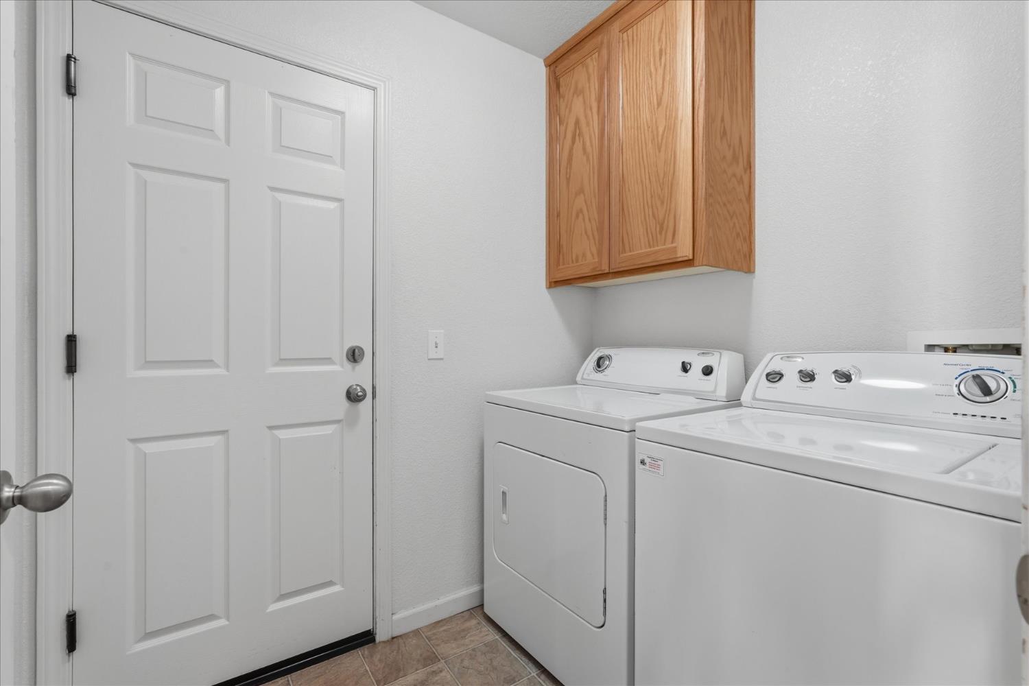 988 Monterey Street Madera, CA 93637 - Photo 25 of 36 a view of storage and utility room with washer and dryer