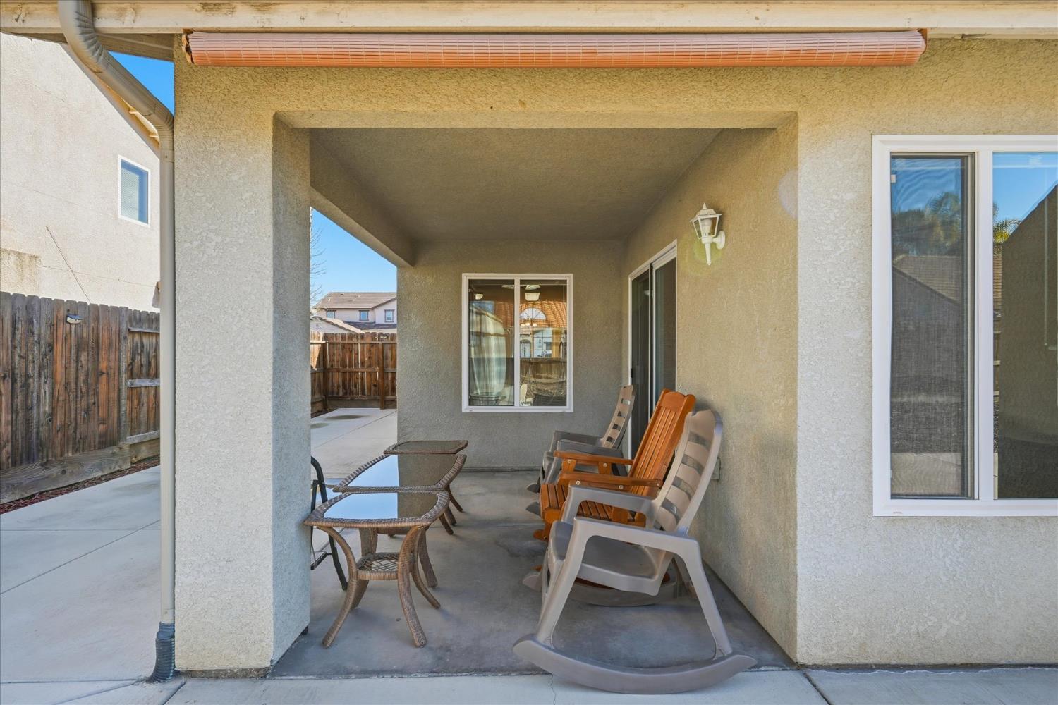 988 Monterey Street Madera, CA 93637 - Photo 29 of 36 a patio with table and chairs