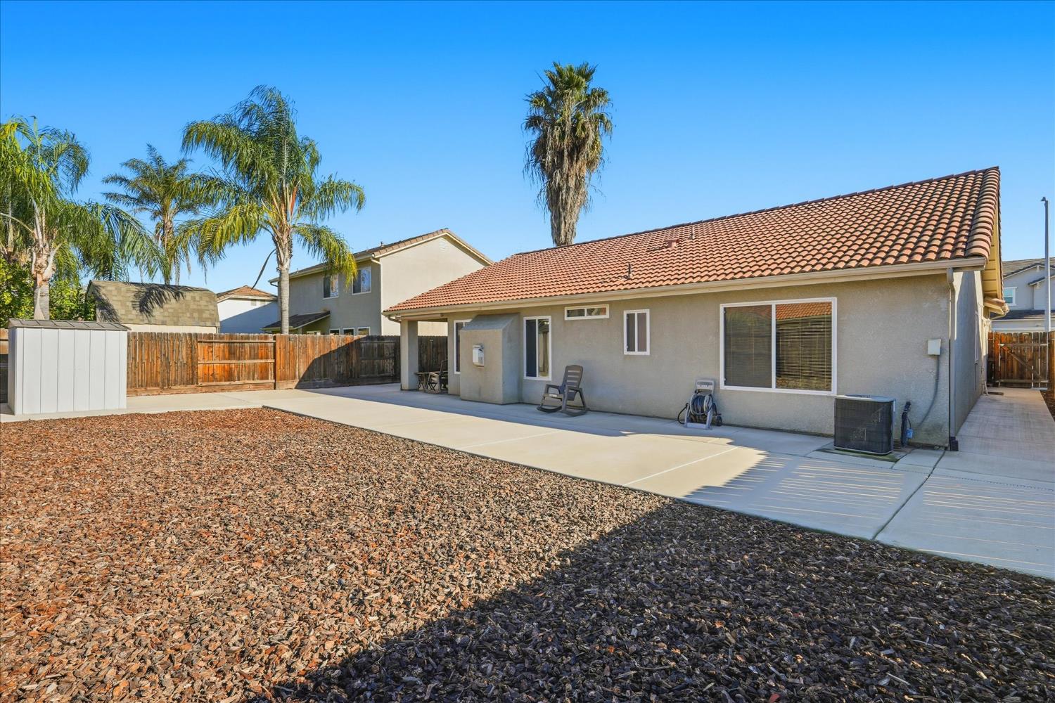 988 Monterey Street Madera, CA 93637 - Photo 35 of 36 a front view of a house with a garden and entryway