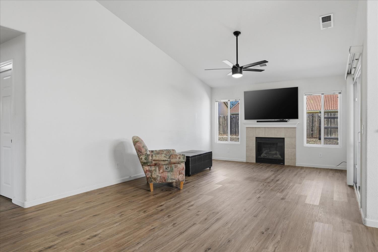 988 Monterey Street Madera, CA 93637 - Photo 5 of 36 a living room with furniture and a flat screen tv