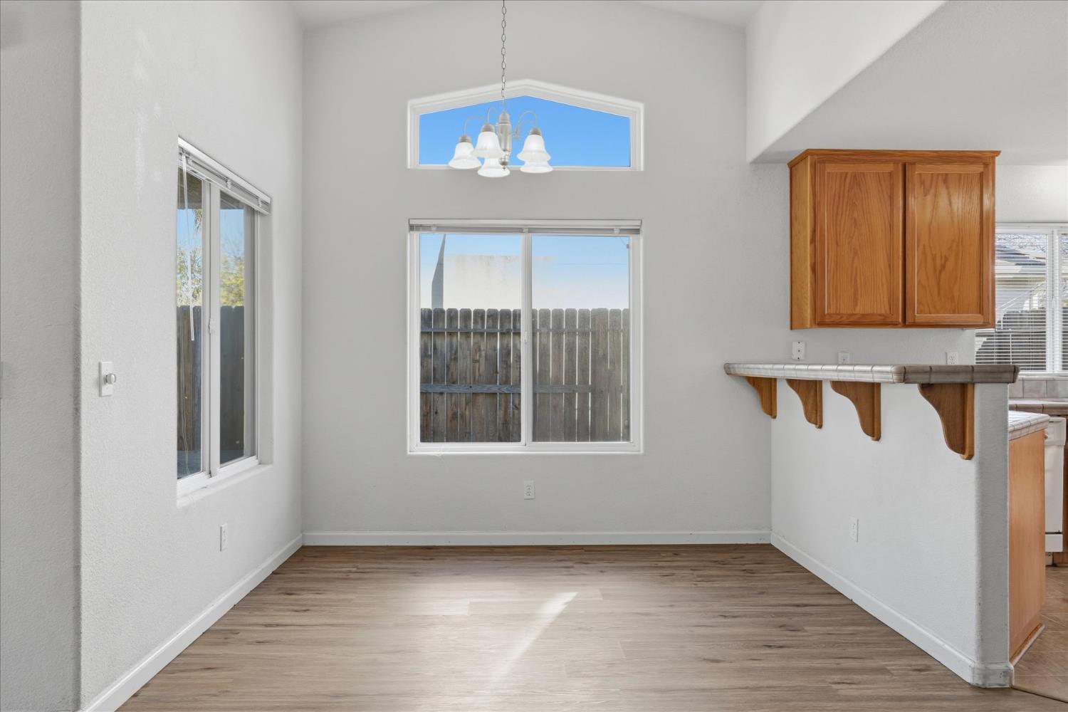 988 Monterey Street Madera, CA 93637 - Photo 8 of 36 a view of an empty room with a window