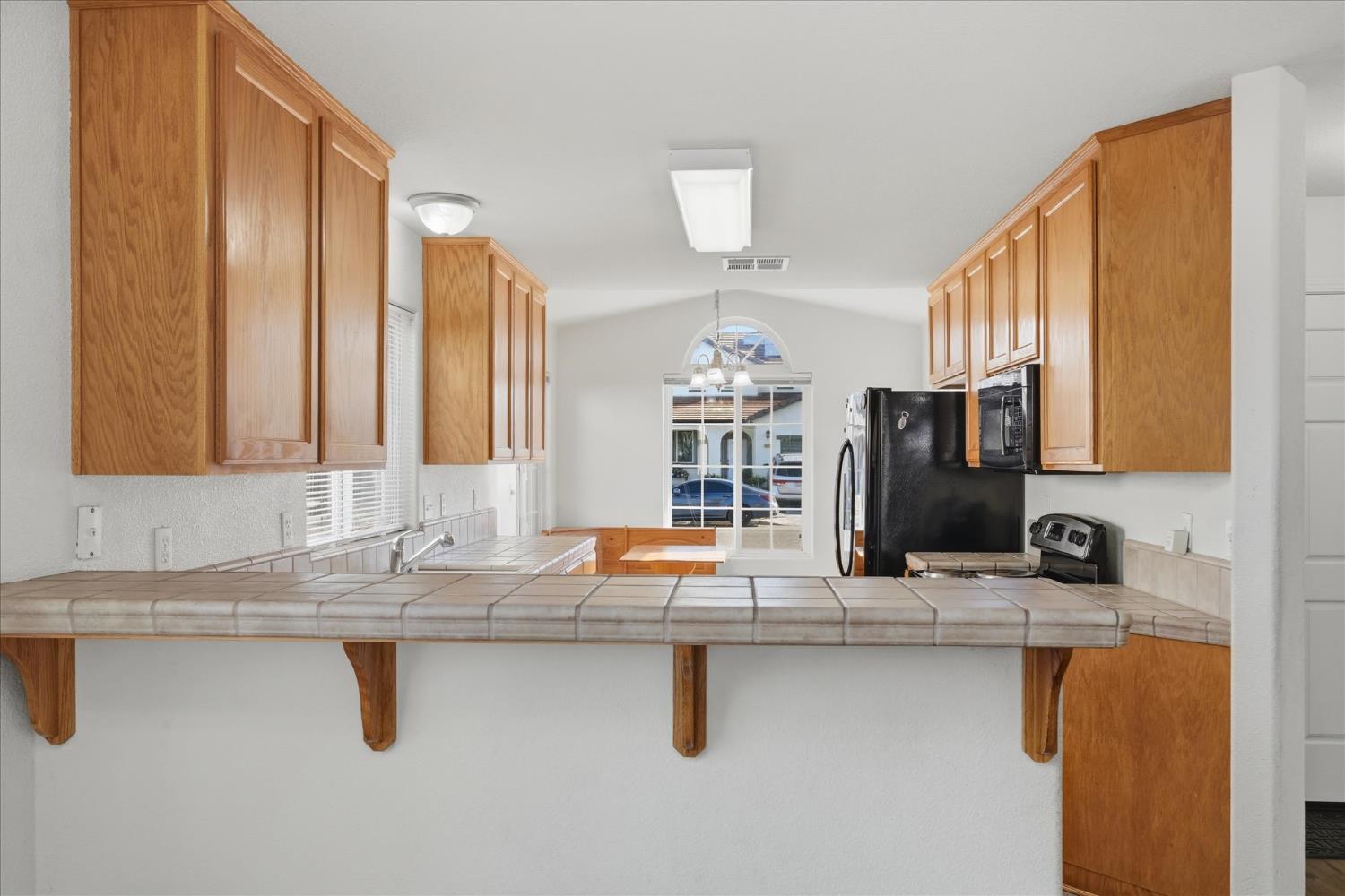 988 Monterey Street Madera, CA 93637 - Photo 10 of 36 a kitchen with counter top space and sink