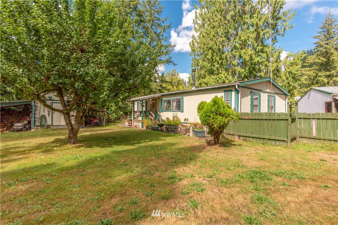 115 Island Road Toledo, WA 98591 - Photo 2 of 22 a view of a house with a backyard