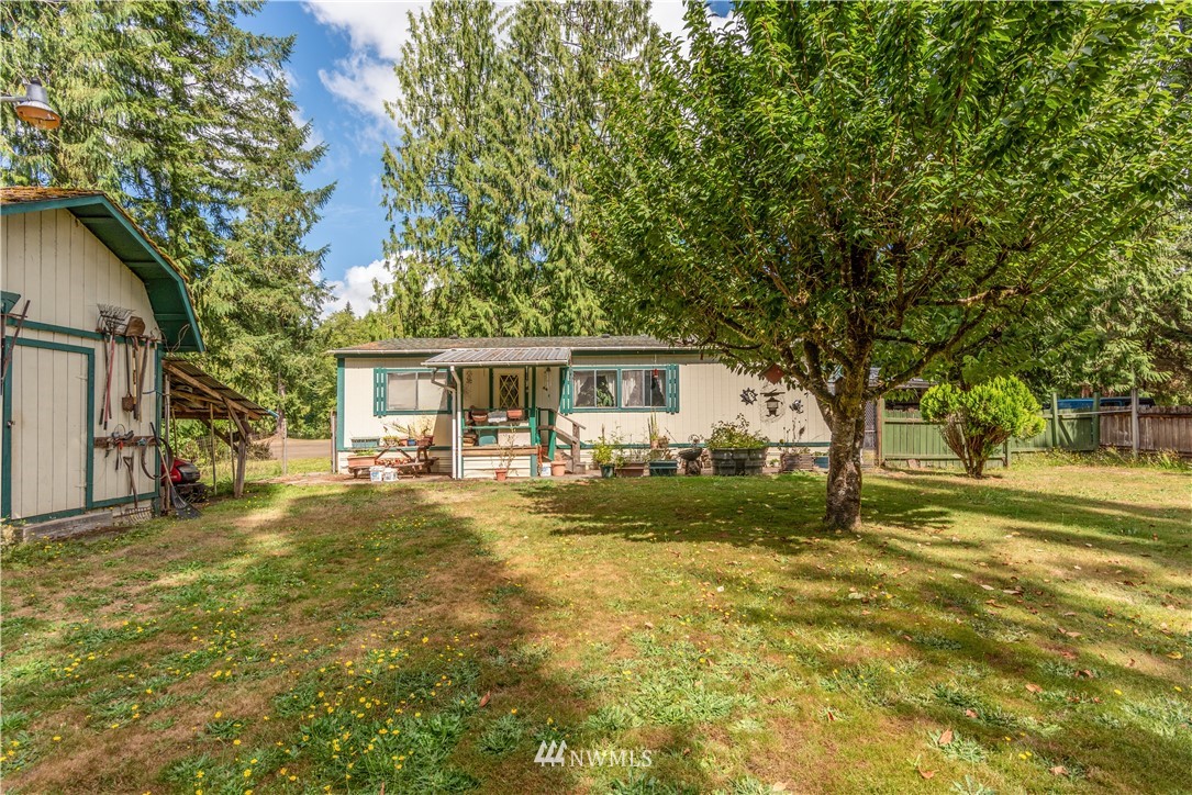 115 Island Road Toledo, WA 98591 - Photo 3 of 22 a front view of house with yard and green space