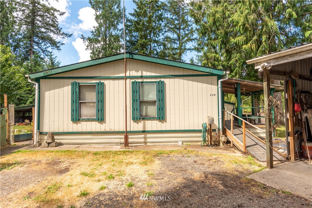 115 Island Road Toledo, WA 98591 - Photo 6 of 22 a view of a house with a backyard