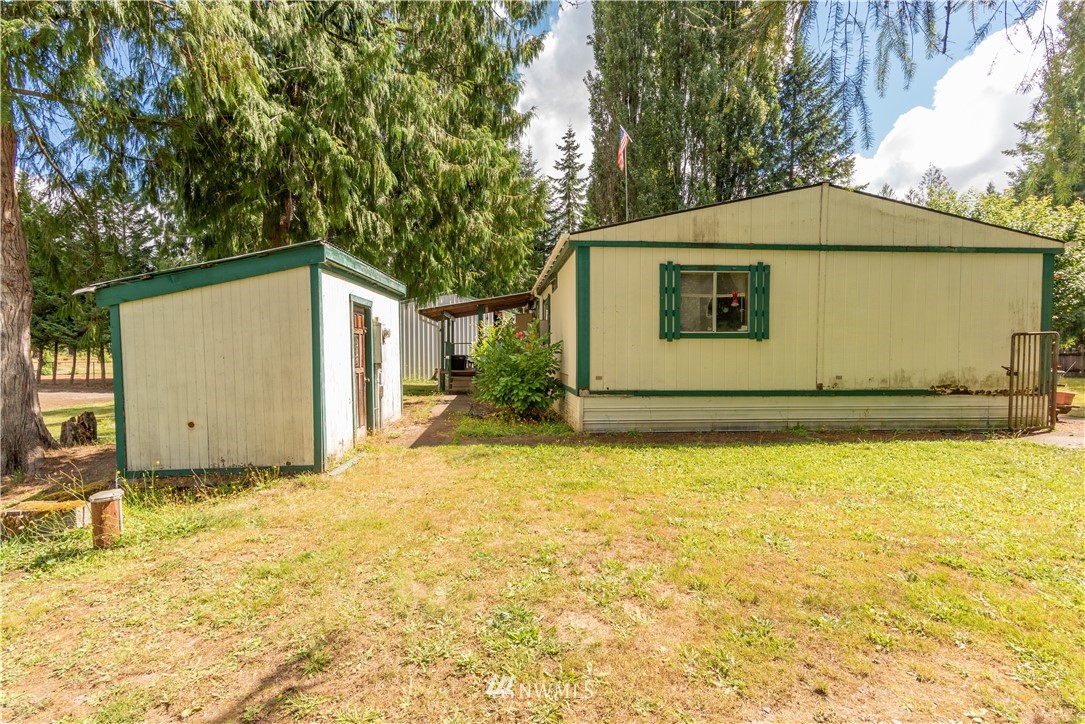 115 Island Road Toledo, WA 98591 - Photo 7 of 22 a house with trees in front of it