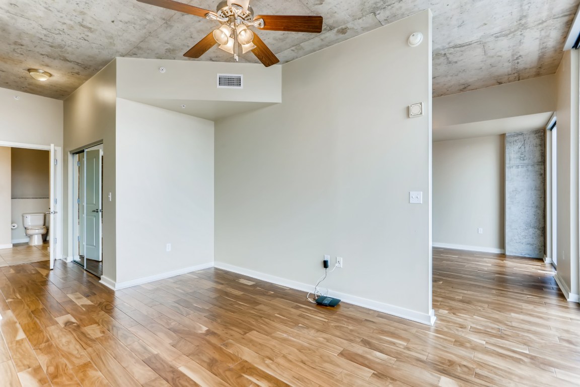 360 Nueces Street, Unit 2607 Austin, TX 78701 - Photo 15 of 23 a view of a hallway with wooden floor