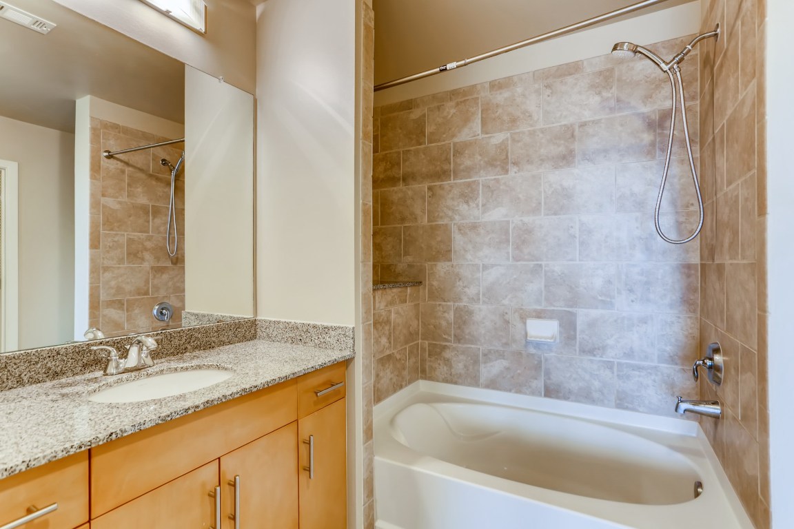 360 Nueces Street, Unit 2607 Austin, TX 78701 - Photo 18 of 23 a bath tub sitting next to a bathroom
