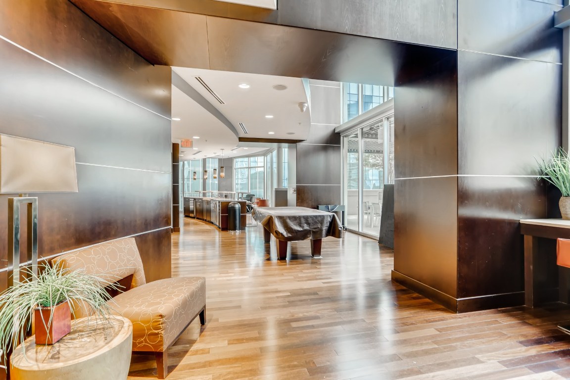 360 Nueces Street, Unit 2607 Austin, TX 78701 - Photo 21 of 23 a lobby with furniture and wooden floor