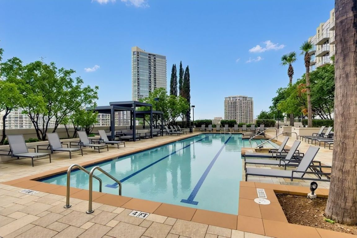 360 Nueces Street, Unit 2607 Austin, TX 78701 - Photo 22 of 23 a view of a swimming pool with outdoor seating and plants