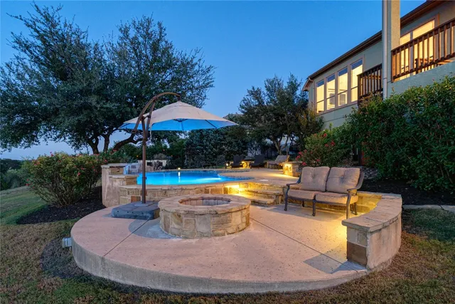a view of swimming pool with outdoor seating