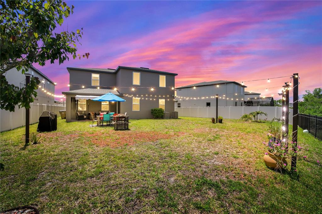 5637 Beggs Road St. Cloud, FL 34771 - Photo 35 of 35 a view of a yard with a house in the background