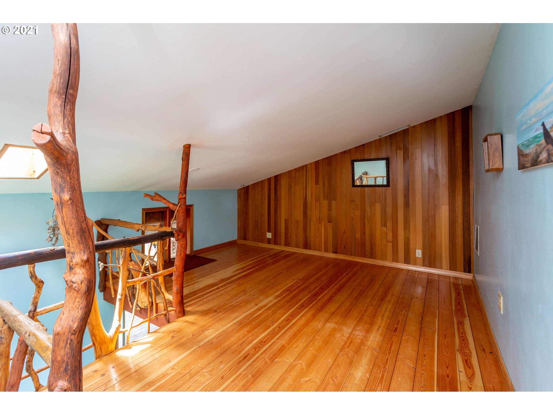 477 Southwest Hawthorn Road Estacada, OR 97023 - Photo 11 of 24 a view of an empty room with wooden floor