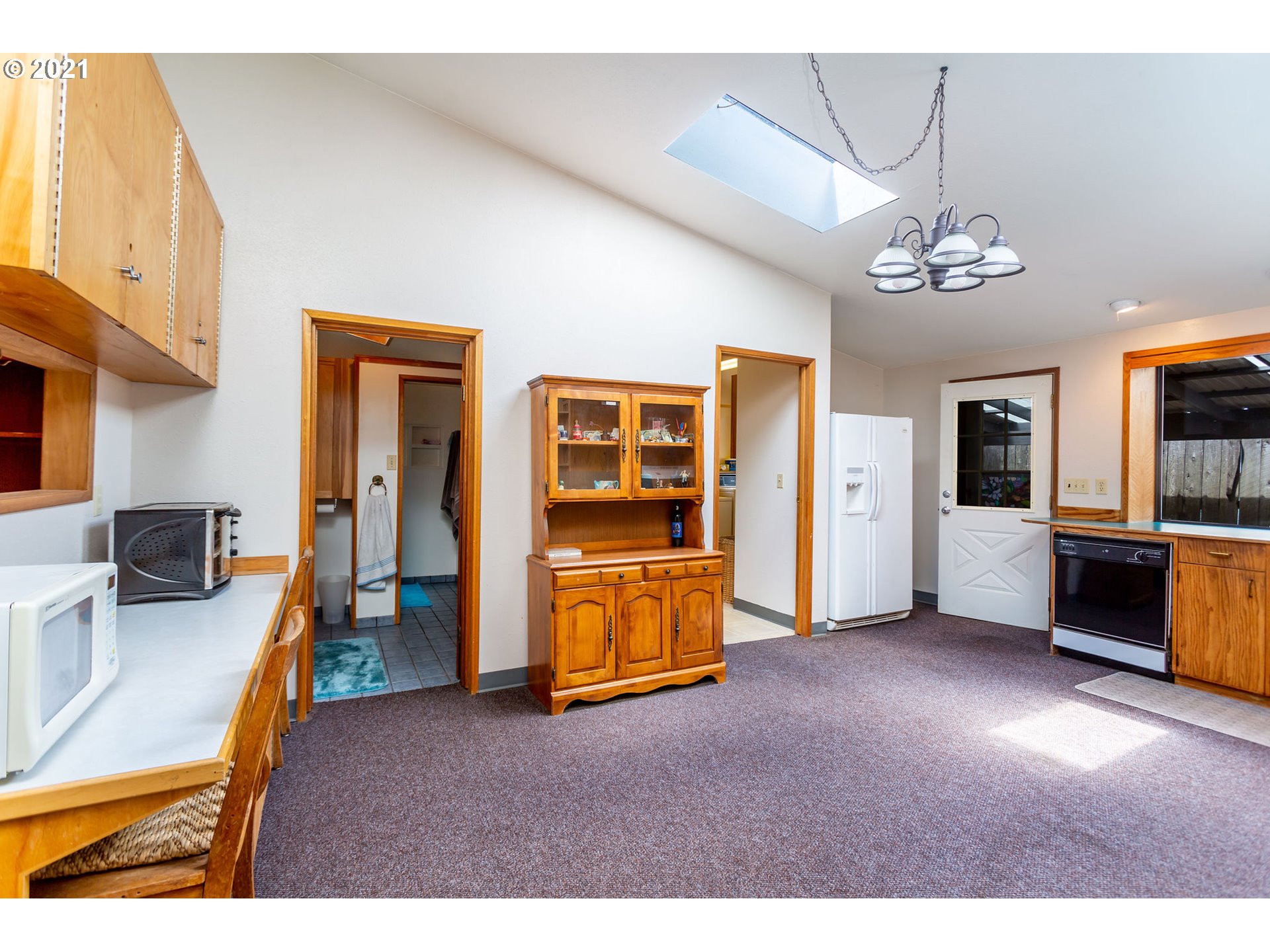 477 Southwest Hawthorn Road Estacada, OR 97023 - Photo 5 of 24 a living room with furniture and a chandelier