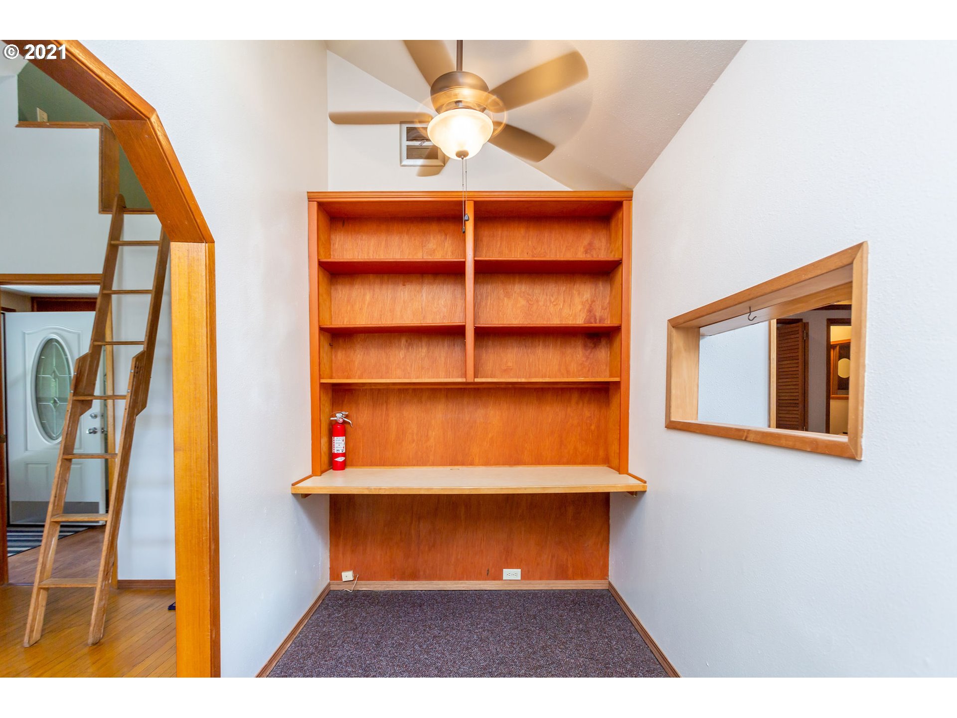 477 Southwest Hawthorn Road Estacada, OR 97023 - Photo 7 of 24 a view of a room with a book shelf