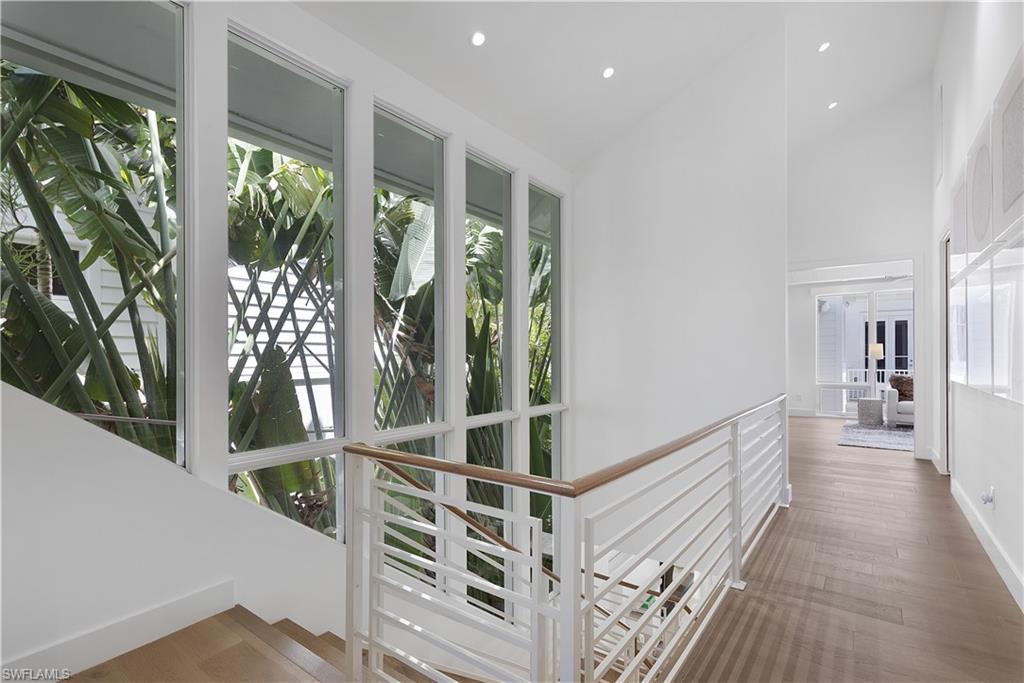 1021 6th Street South Naples, FL 34102 - Photo 15 of 44 a view of entryway with balcony and wooden floor