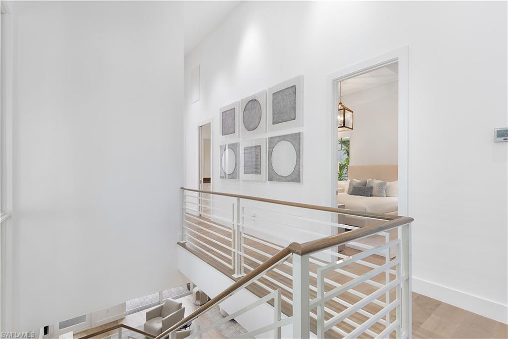 1021 6th Street South Naples, FL 34102 - Photo 16 of 44 wooden floor with white walls and a window