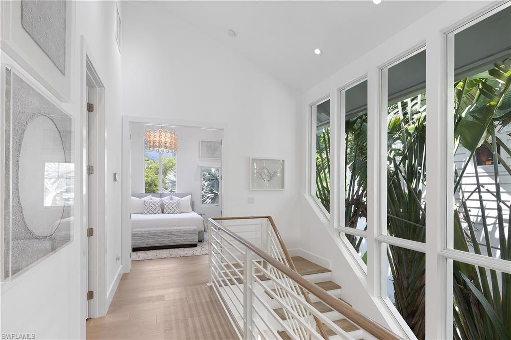 1021 6th Street South Naples, FL 34102 - Photo 17 of 44 a living room with furniture and a large window