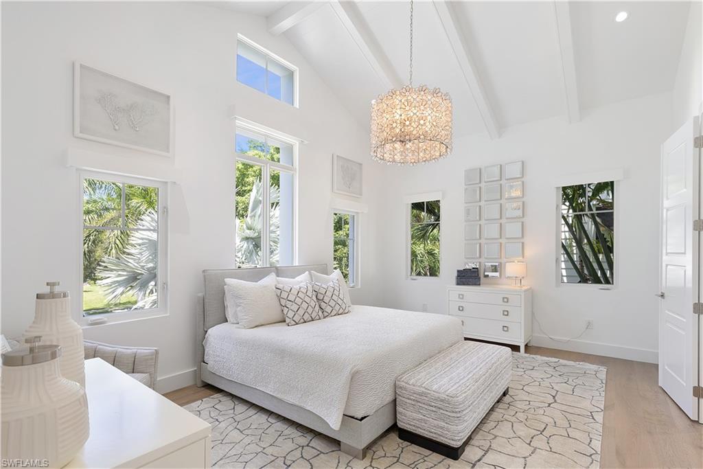 1021 6th Street South Naples, FL 34102 - Photo 19 of 44 a bedroom with a bed and a window