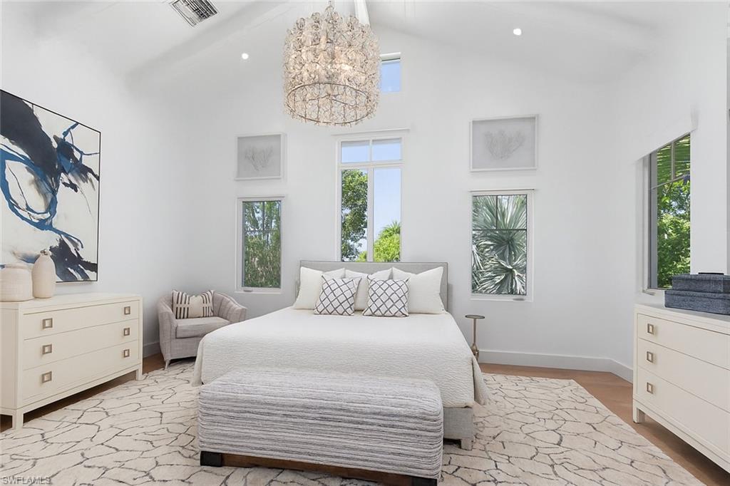 1021 6th Street South Naples, FL 34102 - Photo 21 of 44 a bedroom with a large bed and a window
