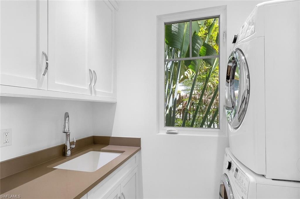 1021 6th Street South Naples, FL 34102 - Photo 22 of 44 a bathroom with a granite countertop sink and a window