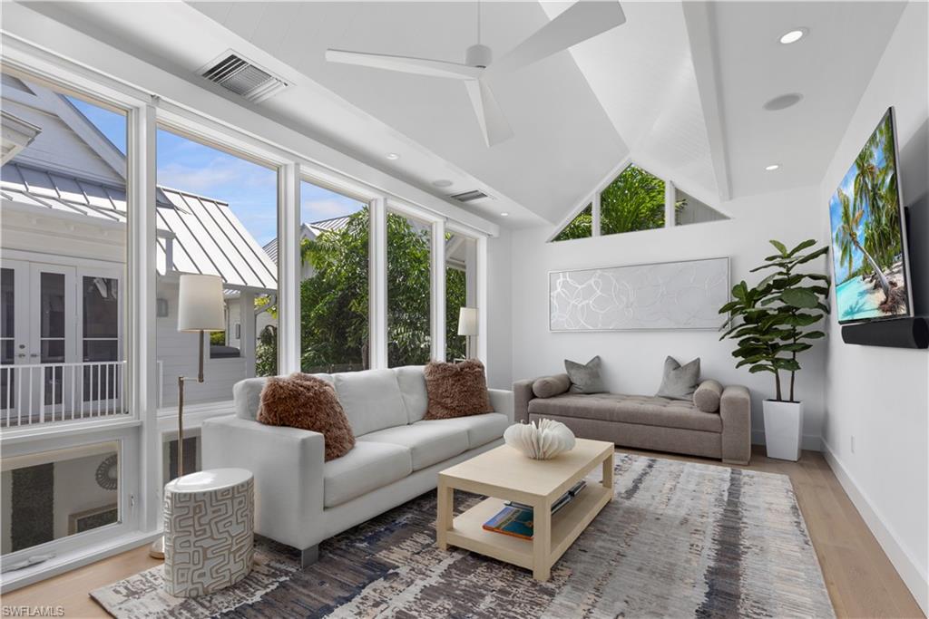 1021 6th Street South Naples, FL 34102 - Photo 26 of 44 a living room with furniture and a large window
