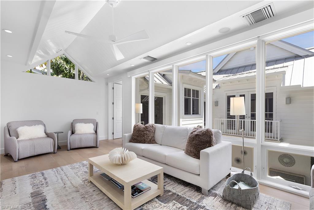 1021 6th Street South Naples, FL 34102 - Photo 27 of 44 a living room with furniture and a large window