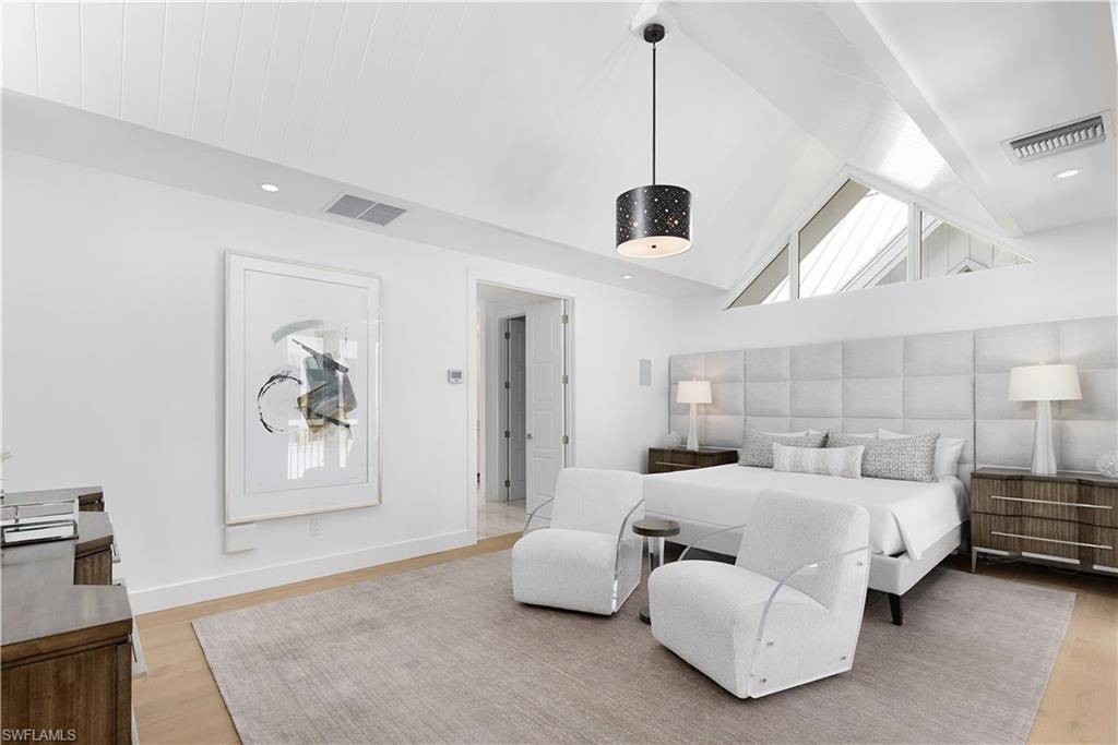 1021 6th Street South Naples, FL 34102 - Photo 33 of 44 a room with a bed and ceiling fan