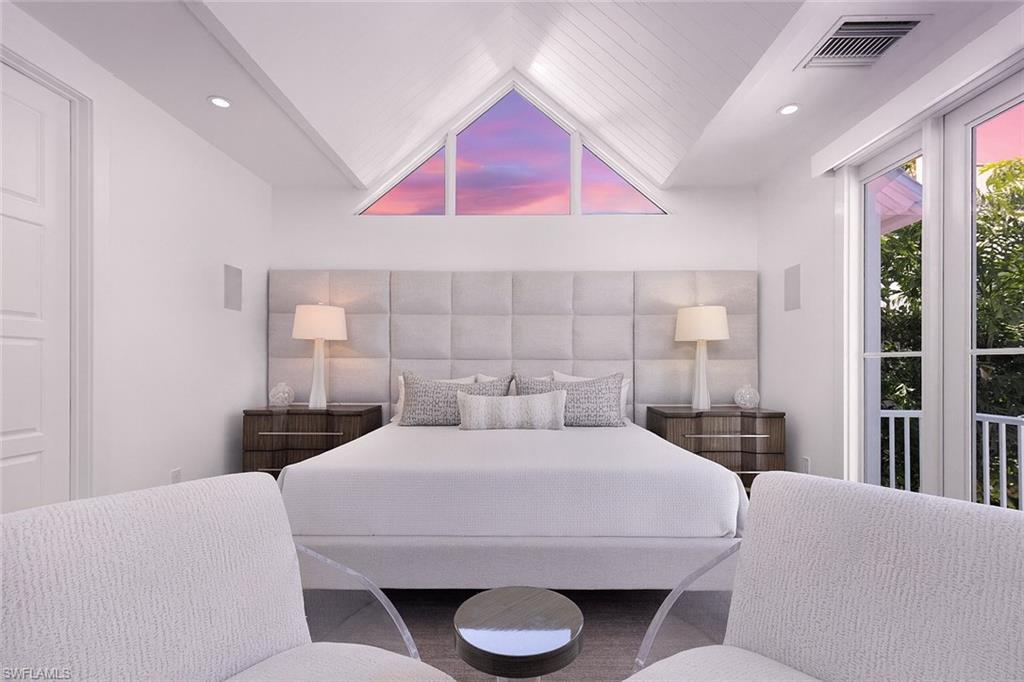 1021 6th Street South Naples, FL 34102 - Photo 34 of 44 a bedroom with a large bed and a potted plant