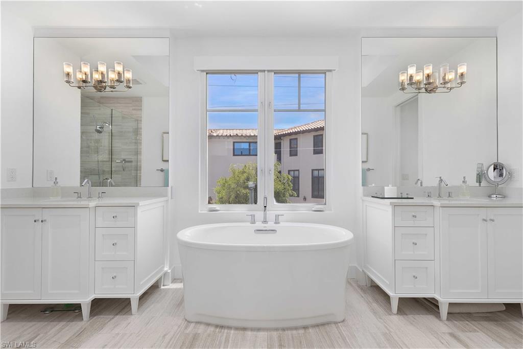 1021 6th Street South Naples, FL 34102 - Photo 36 of 44 a bathroom with a sink double vanity and a mirror