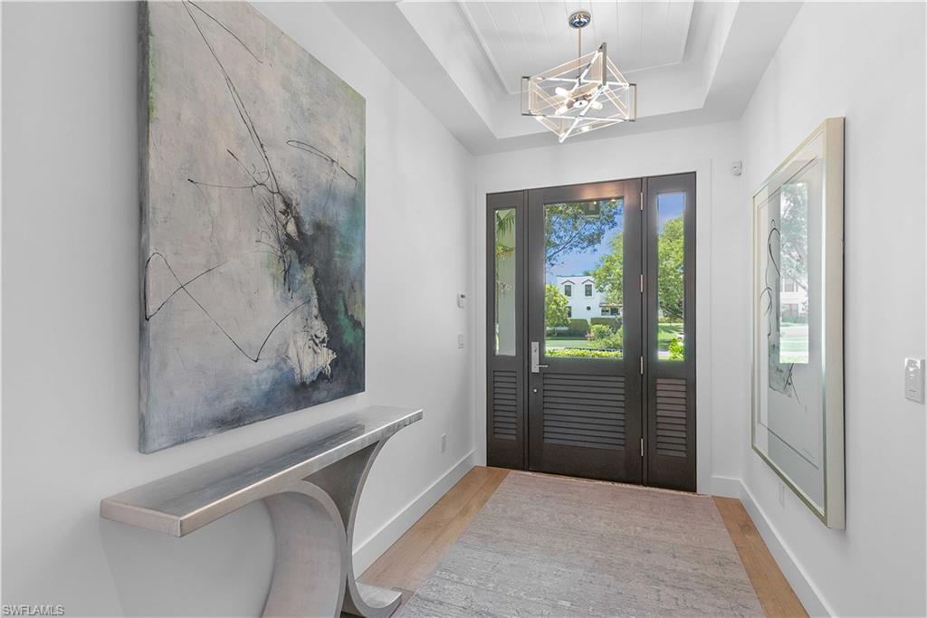 1021 6th Street South Naples, FL 34102 - Photo 3 of 44 a view of a hallway with windows and entryway