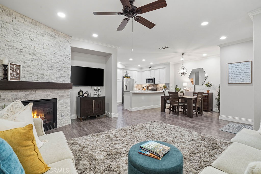 7701 Chambray Place, Unit 3 Rancho Cucamonga, CA 91739 - Photo 18 of 52 a living room with furniture and a fireplace
