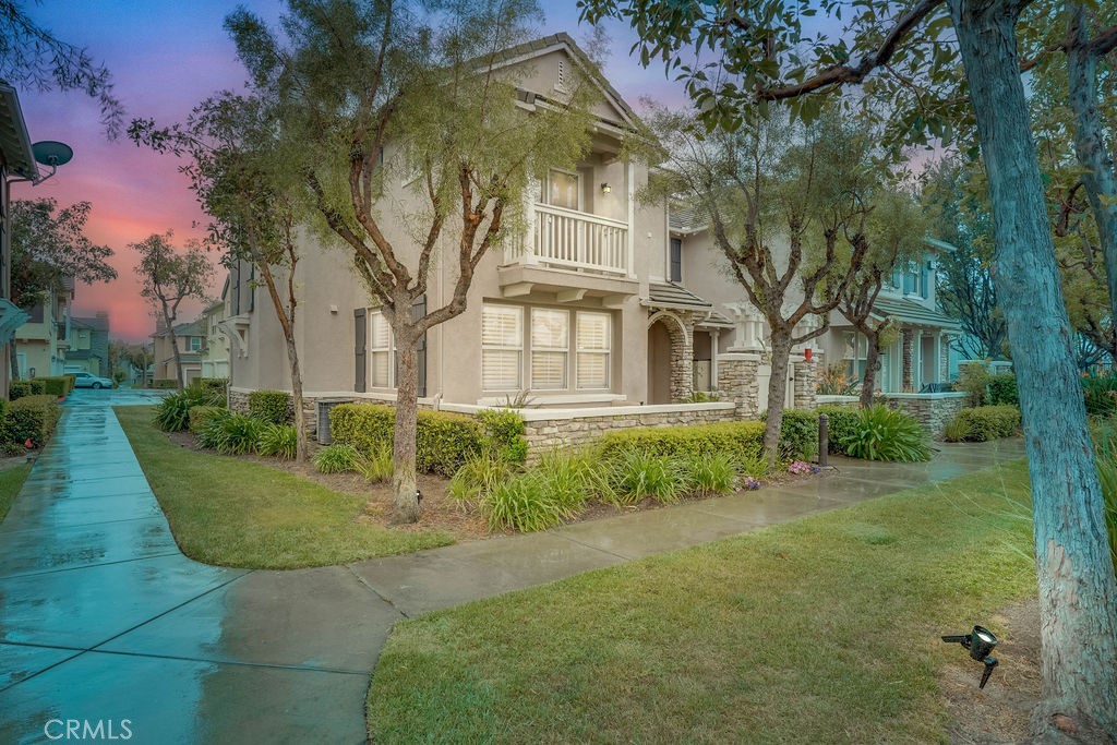 7701 Chambray Place, Unit 3 Rancho Cucamonga, CA 91739 - Photo 2 of 52 a view of a big yard with plants and large trees