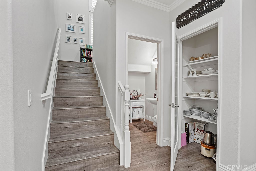 7701 Chambray Place, Unit 3 Rancho Cucamonga, CA 91739 - Photo 21 of 52 a view of a hallway with closet and wooden floor