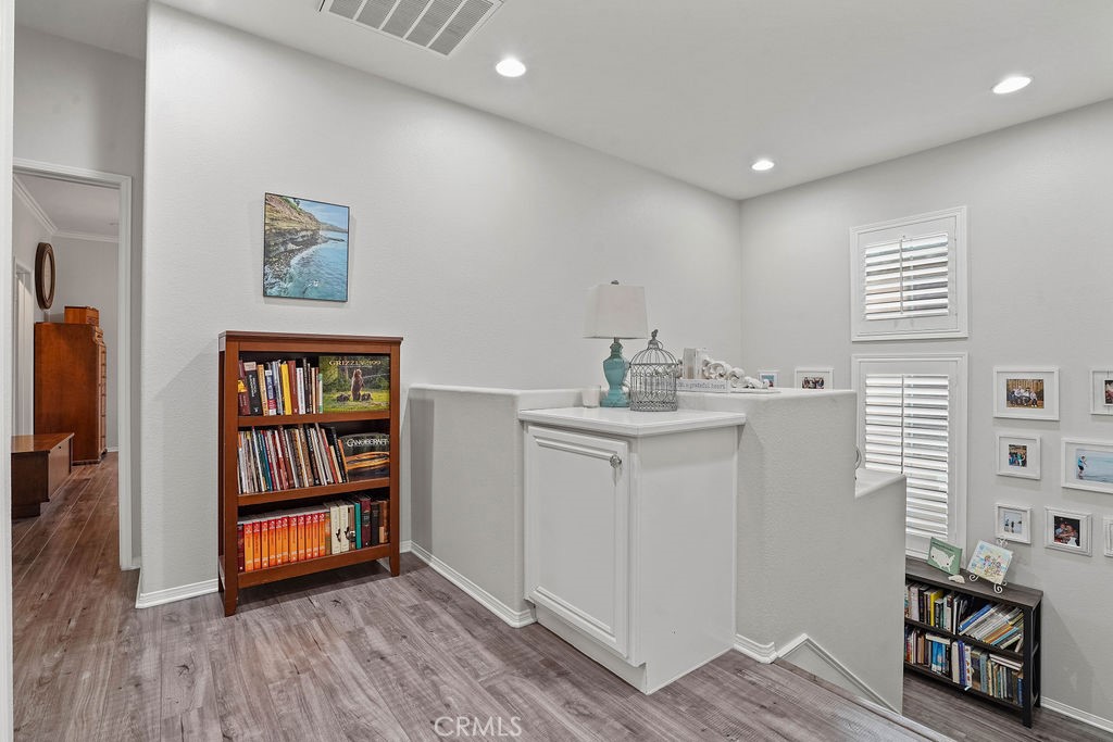 7701 Chambray Place, Unit 3 Rancho Cucamonga, CA 91739 - Photo 22 of 52 a view of an empty room with window and wooden floor