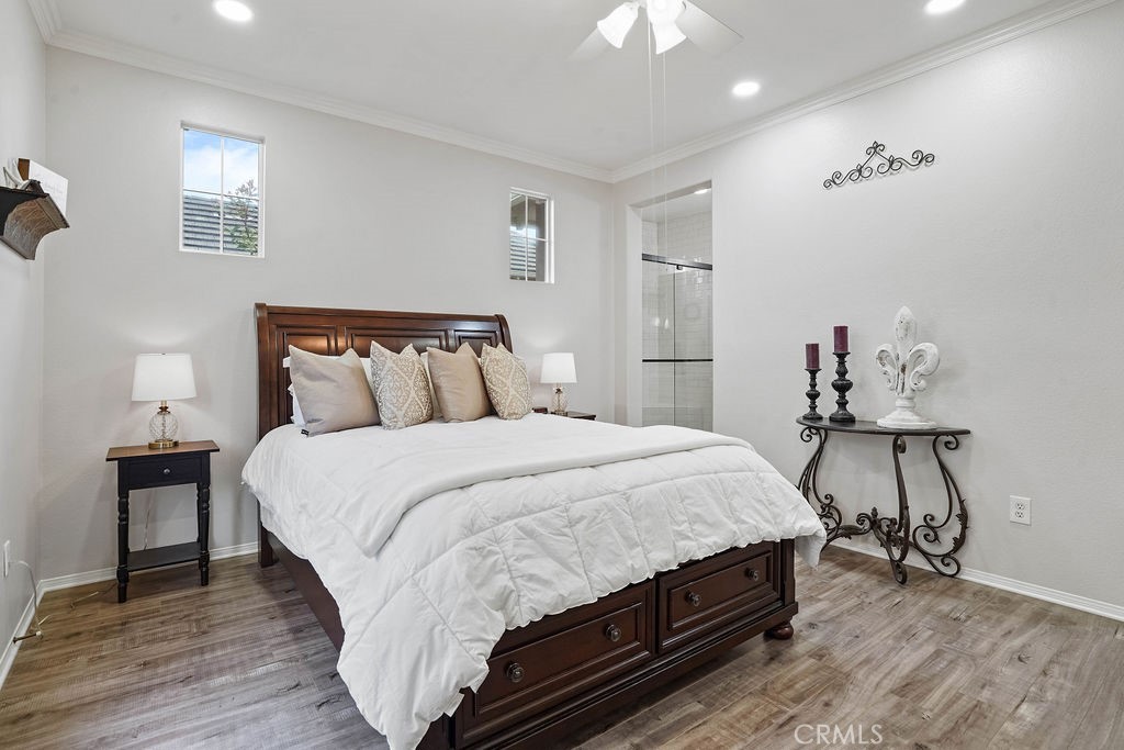 7701 Chambray Place, Unit 3 Rancho Cucamonga, CA 91739 - Photo 25 of 52 a bedroom with bed and wooden floor