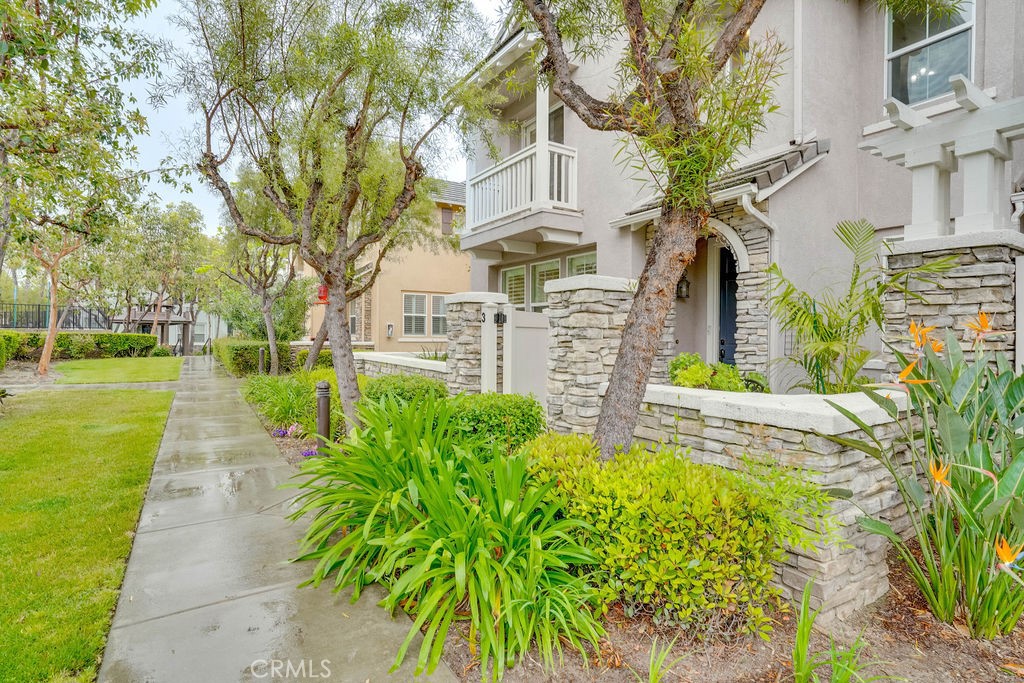 7701 Chambray Place, Unit 3 Rancho Cucamonga, CA 91739 - Photo 3 of 52 a front view of a building with garden