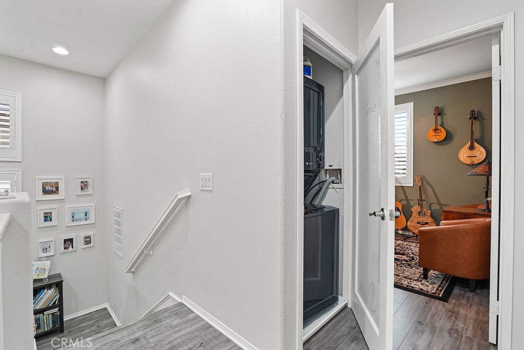 7701 Chambray Place, Unit 3 Rancho Cucamonga, CA 91739 - Photo 31 of 52 a view of a hallway and a livingroom with furniture