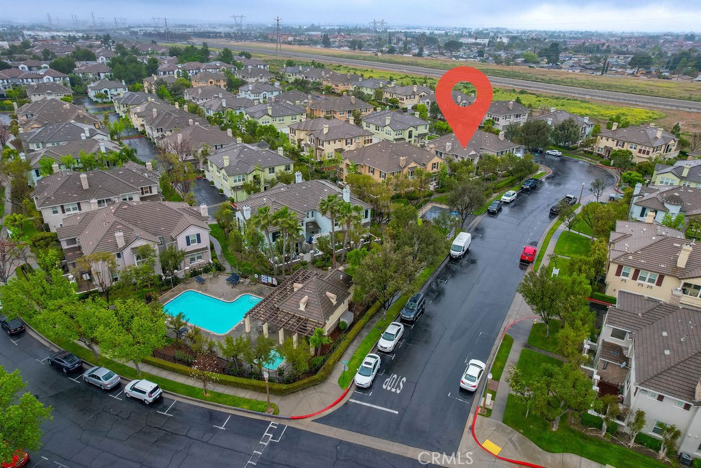 7701 Chambray Place, Unit 3 Rancho Cucamonga, CA 91739 - Photo 39 of 52 an aerial view of a house a garden and lake view