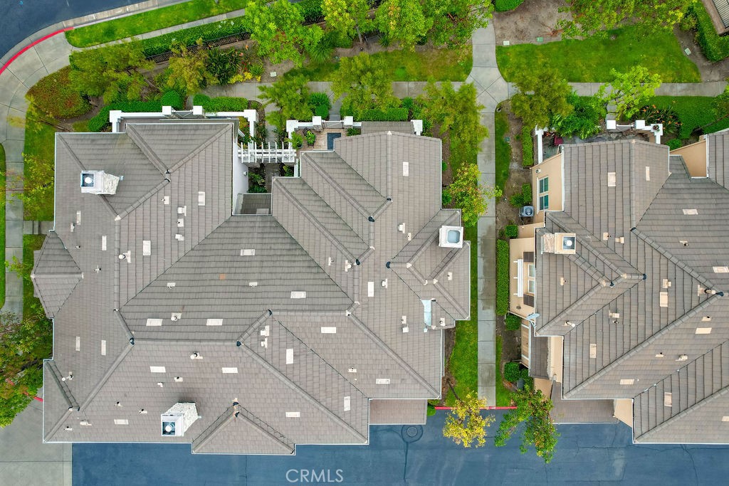 7701 Chambray Place, Unit 3 Rancho Cucamonga, CA 91739 - Photo 40 of 52 an aerial view of a house with a yard and potted plants