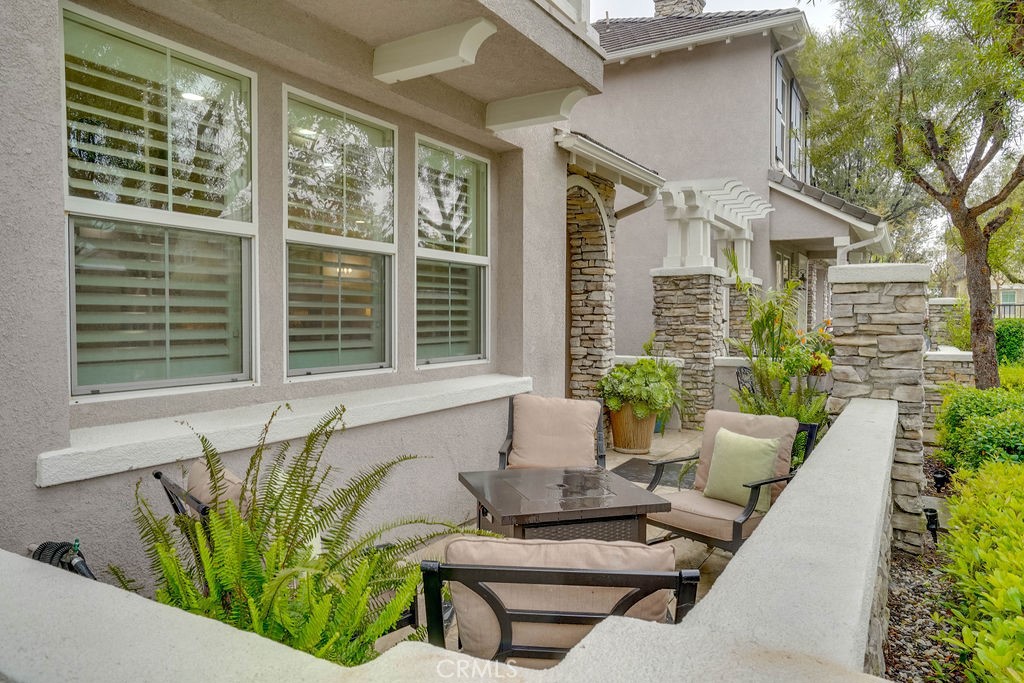 7701 Chambray Place, Unit 3 Rancho Cucamonga, CA 91739 - Photo 4 of 52 a view of an house with backyard and sitting area